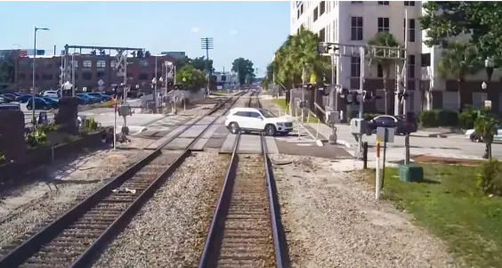 SunRail Get A Clue Photo 4 - Car stopped on train tracks.